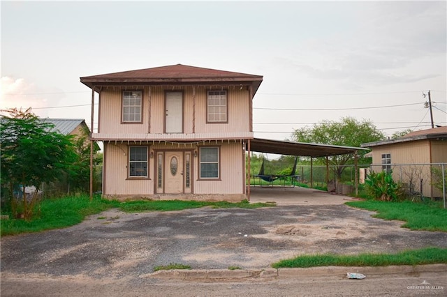 view of front facade with a carport