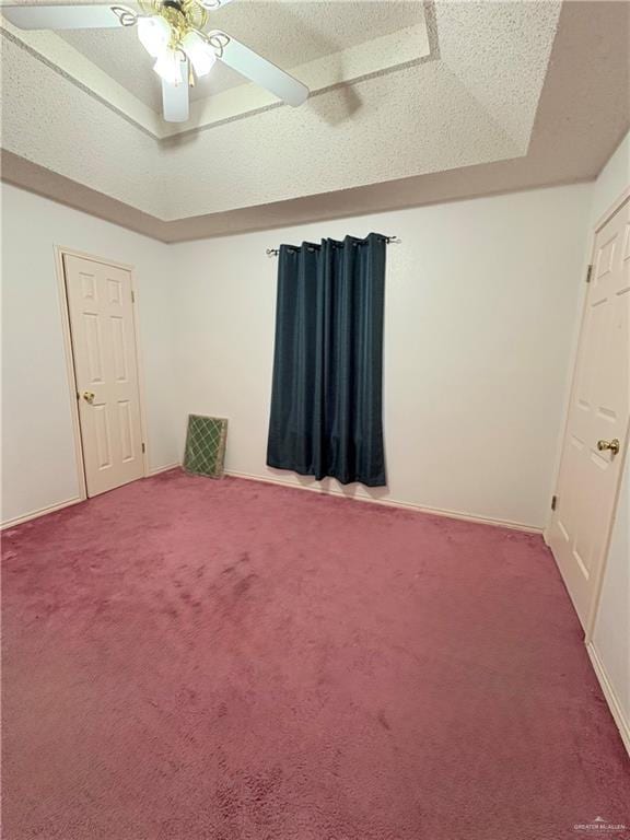 2218 Lawndale Rd, Mission, TX 78572 - carpeted empty room featuring a tray ceiling, baseboards, and ceiling fan