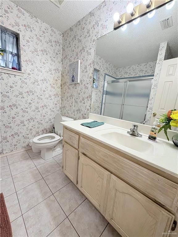 2218 Lawndale Rd, Mission, TX 78572 - bathroom with toilet, tile patterned flooring, visible vents, and a stall shower