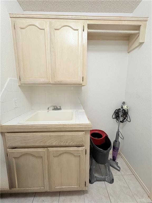 2218 Lawndale Rd, Mission, TX 78572 - bathroom featuring tile patterned flooring, baseboards, and vanity