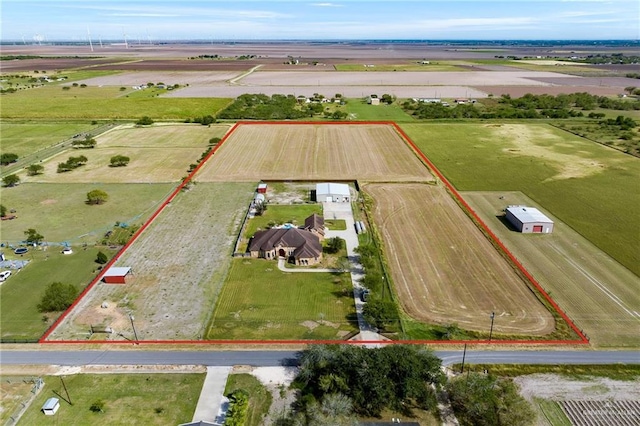 birds eye view of property featuring a rural view