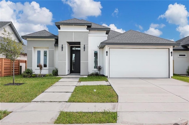 910 Azalea St, Mission, TX 78574 - prairie-style house with stucco siding, a garage, driveway, and roof with shingles