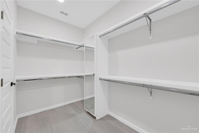 910 Azalea St, Mission, TX 78574 - spacious closet with wood finished floors