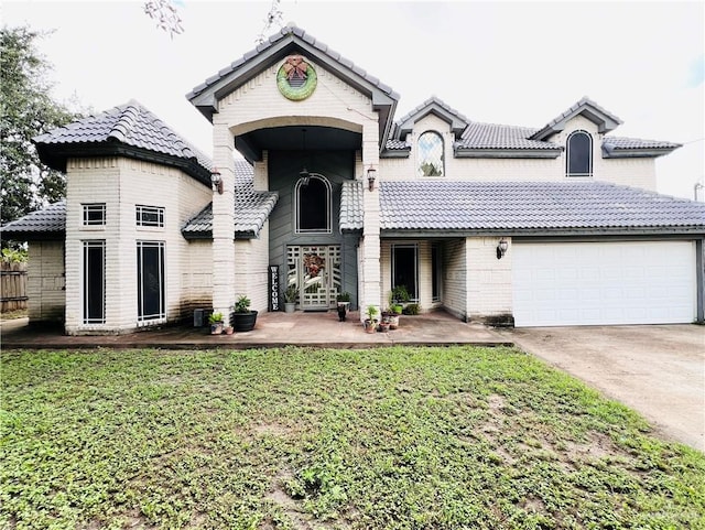 view of front of home with a garage and a front yard