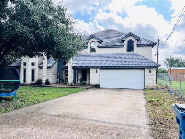 view of front property with a front lawn and a trampoline