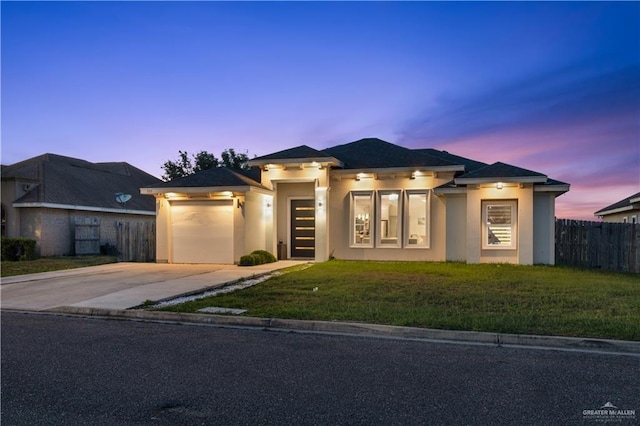 705 New Orleans Cir, Pharr, TX 78577 - prairie-style home with stucco siding, concrete driveway, and an attached garage