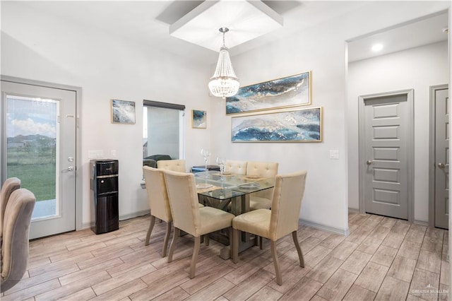 705 New Orleans Cir, Pharr, TX 78577 - dining space featuring light wood finished floors, a chandelier, and baseboards