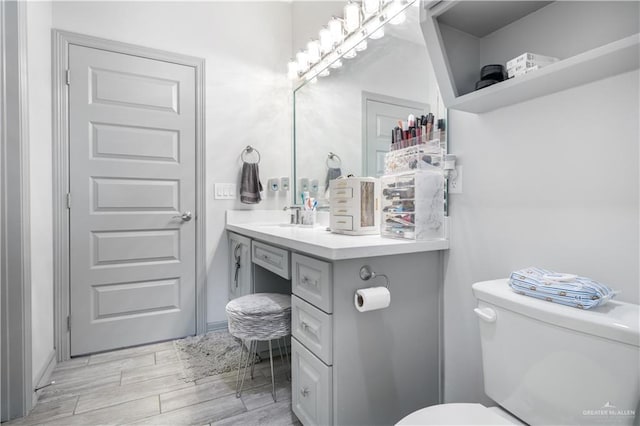 705 New Orleans Cir, Pharr, TX 78577 - half bath featuring toilet, wood finished floors, and vanity