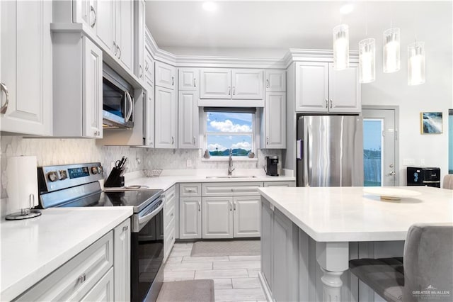 705 New Orleans Cir, Pharr, TX 78577 - kitchen with appliances with stainless steel finishes, a sink, light countertops, and tasteful backsplash