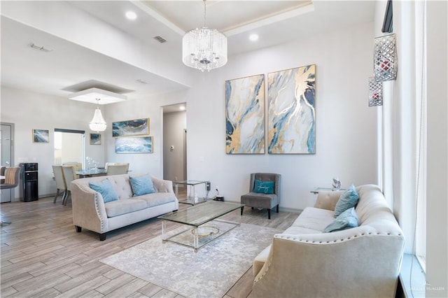 705 New Orleans Cir, Pharr, TX 78577 - living room with wood finished floors, a chandelier, and a raised ceiling