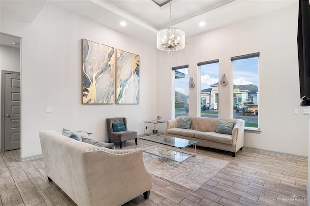 705 New Orleans Cir, Pharr, TX 78577 - living area featuring light wood-type flooring, a chandelier, a tray ceiling, and recessed lighting