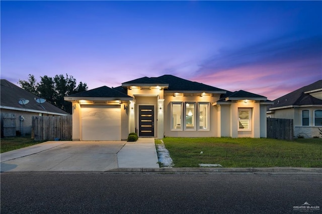 705 New Orleans Cir, Pharr, TX 78577 - prairie-style home featuring concrete driveway, stucco siding, and a garage