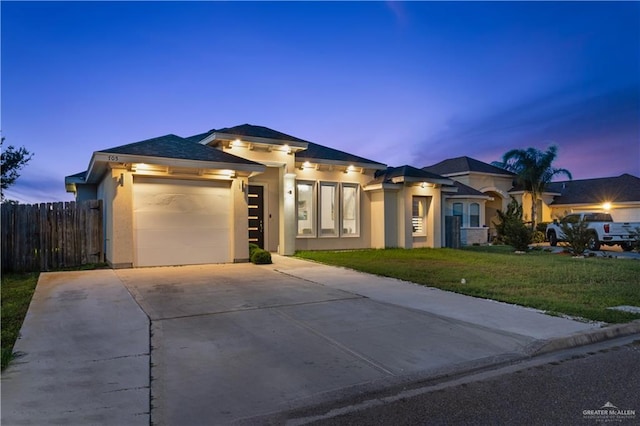 705 New Orleans Cir, Pharr, TX 78577 - prairie-style home with a garage, concrete driveway, and stucco siding