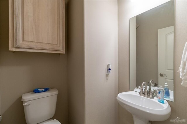 bathroom with a sink and toilet