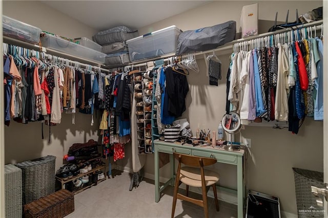 spacious closet featuring tile patterned flooring