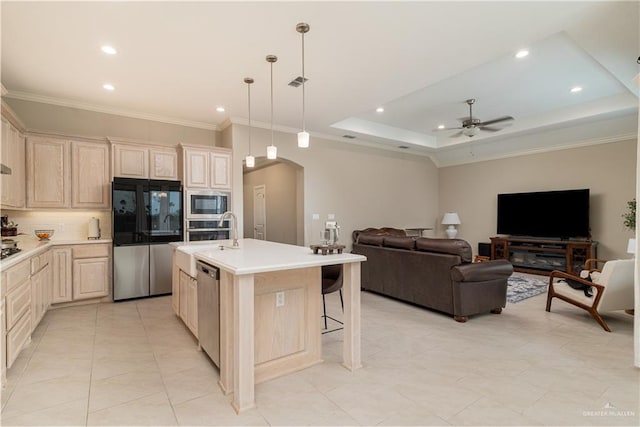 kitchen with arched walkways, visible vents, open floor plan, light countertops, and appliances with stainless steel finishes