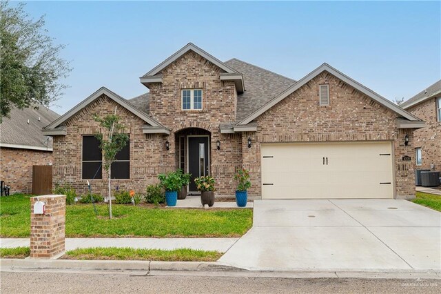 view of front facade featuring a garage and a front lawn