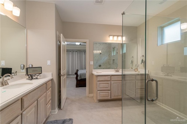 ensuite bathroom featuring two vanities, ensuite bathroom, a stall shower, a sink, and tile patterned floors