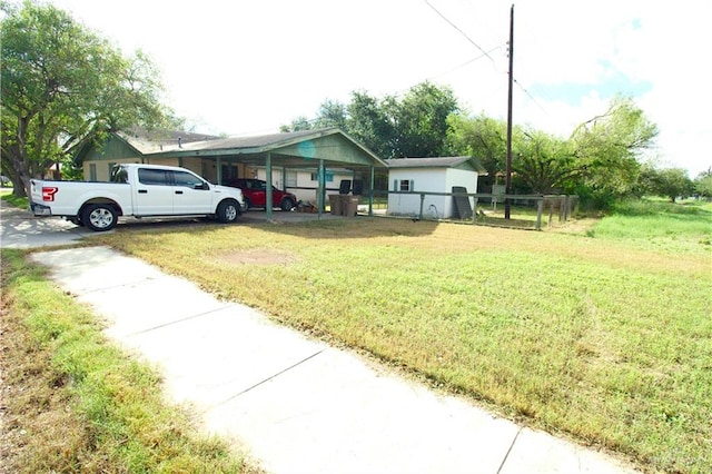 view of front of home featuring a front lawn and a carport