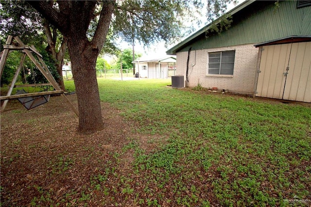 view of yard with central air condition unit