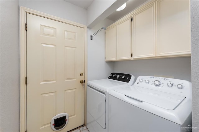 2106 Quail Ln, Mission, TX 78572 - laundry area with cabinet space and washing machine and dryer