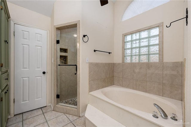 2106 Quail Ln, Mission, TX 78572 - full bathroom featuring a bath, a stall shower, and tile patterned flooring