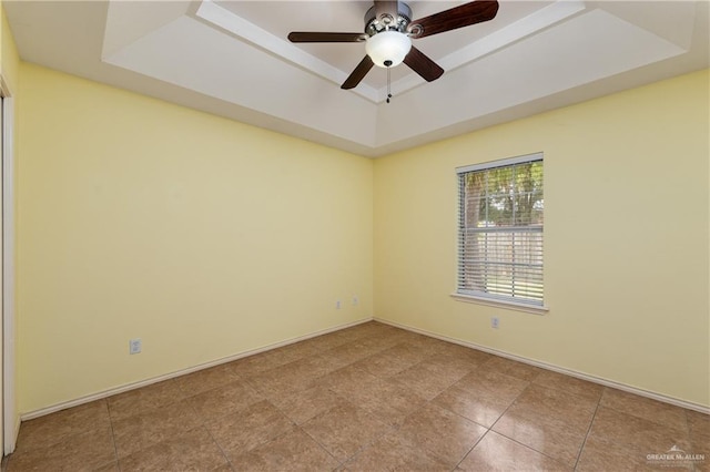 2106 Quail Ln, Mission, TX 78572 - tiled empty room with a raised ceiling, ceiling fan, and baseboards