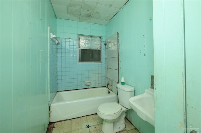 bathroom featuring shower / bathing tub combination, a sink, and toilet