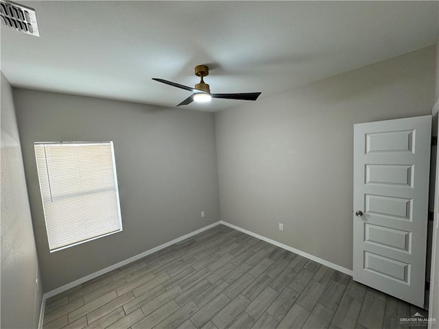 spare room with ceiling fan and light hardwood / wood-style floors