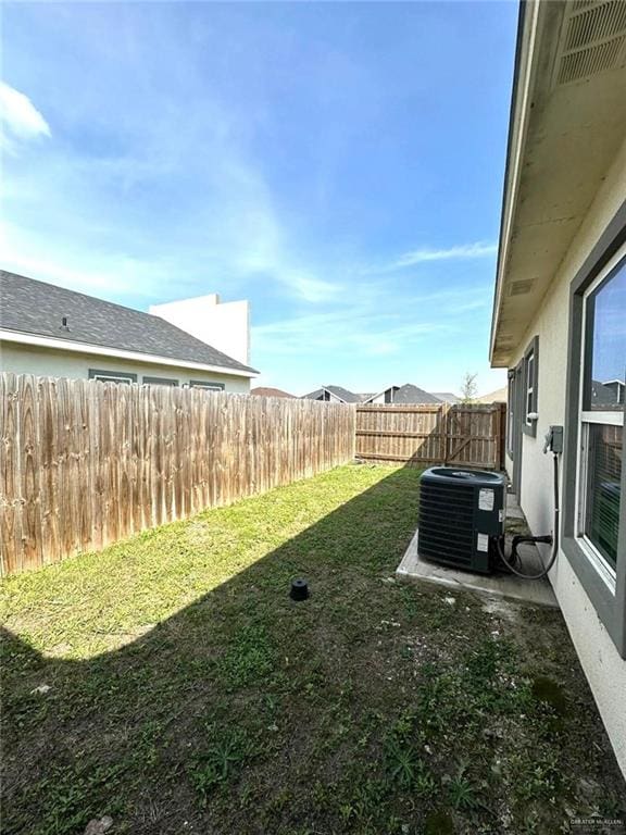 view of yard with central air condition unit