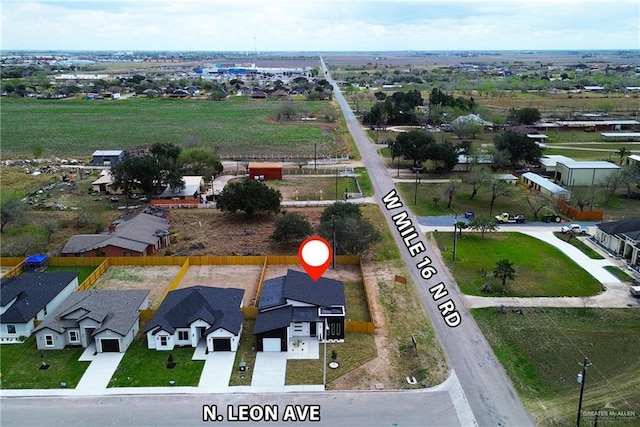 birds eye view of property with a residential view