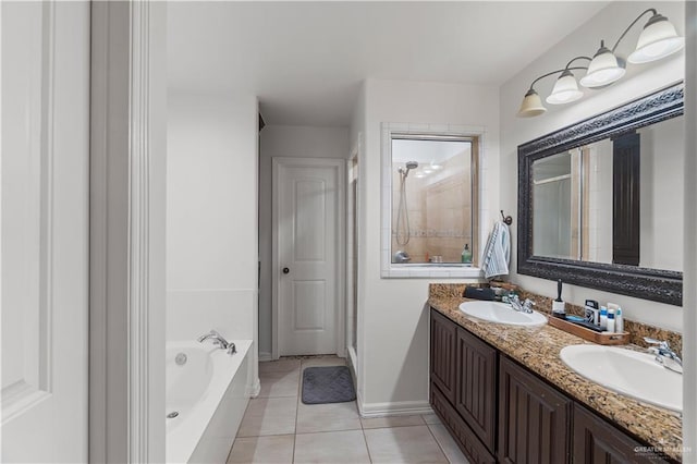 bathroom featuring tile patterned floors, vanity, and plus walk in shower