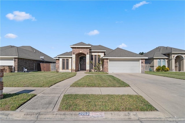 view of front facade with a front yard and a garage