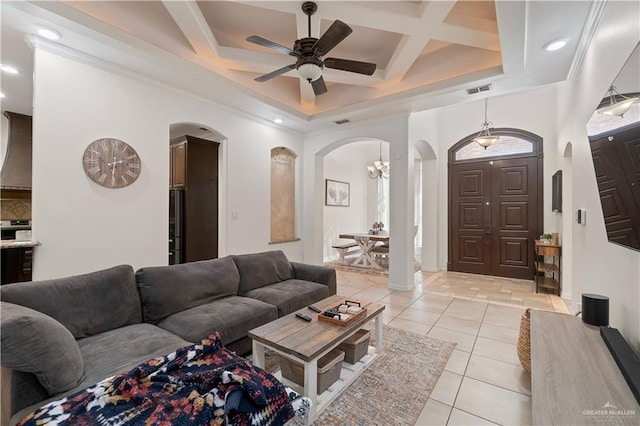 living room featuring beam ceiling, ceiling fan, coffered ceiling, crown molding, and light tile patterned floors