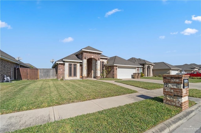 view of front of home featuring a front lawn and a garage