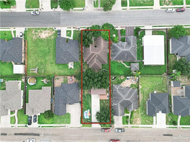 birds eye view of property with a residential view