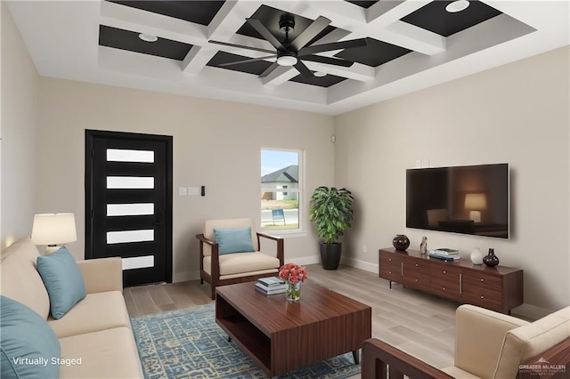 living area with baseboards, coffered ceiling, ceiling fan, light wood-style flooring, and beam ceiling