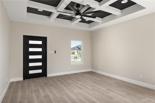 foyer with light wood-style flooring and baseboards