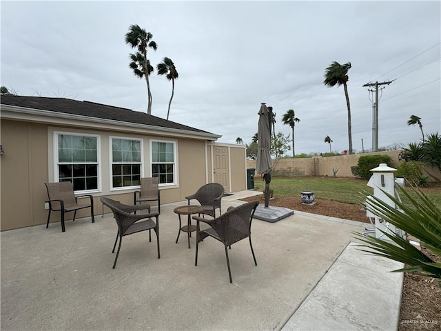 view of patio / terrace featuring fence