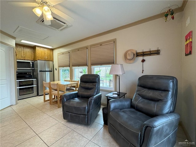 living room featuring crown molding, light tile patterned floors, a wall mounted AC, attic access, and ceiling fan