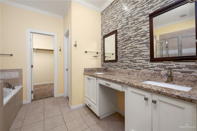 4012 Toronto Ave, Mcallen, TX 78503 - bathroom featuring double vanity, a shower stall, a bath, tile patterned floors, and a spacious closet