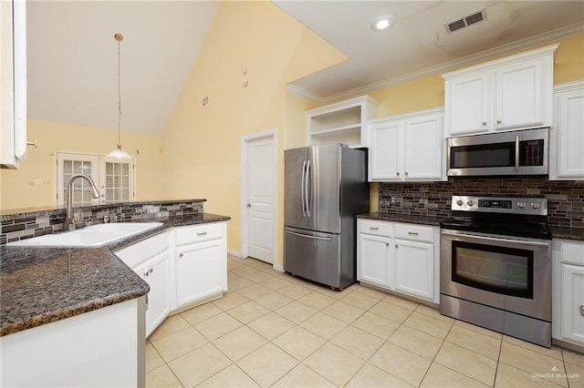 4012 Toronto Ave, Mcallen, TX 78503 - kitchen with stainless steel appliances, a sink, backsplash, white cabinetry, and recessed lighting