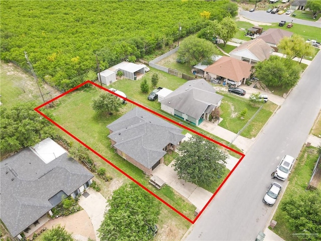 birds eye view of property with a residential view