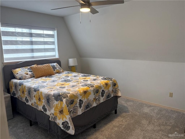 carpeted bedroom featuring vaulted ceiling and ceiling fan