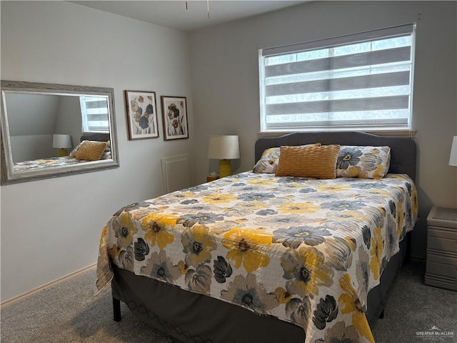 bedroom featuring dark colored carpet