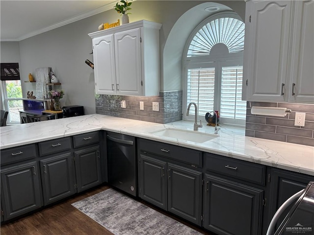 kitchen featuring sink, dark wood-type flooring, dishwasher, ornamental molding, and white cabinets