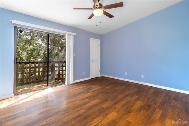 spare room featuring ceiling fan, wood finished floors, and baseboards