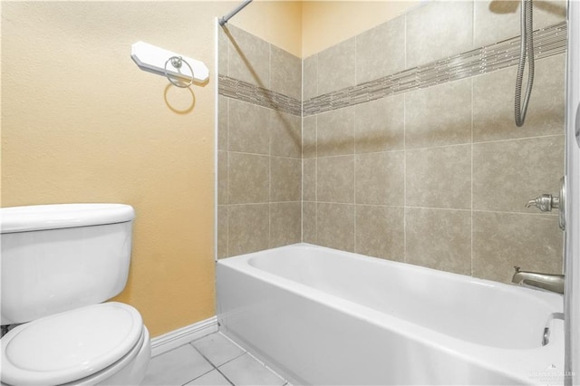 full bath featuring shower / bathing tub combination, tile patterned flooring, toilet, and baseboards