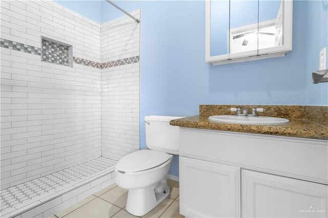 full bath with toilet, a shower stall, tile patterned flooring, and vanity