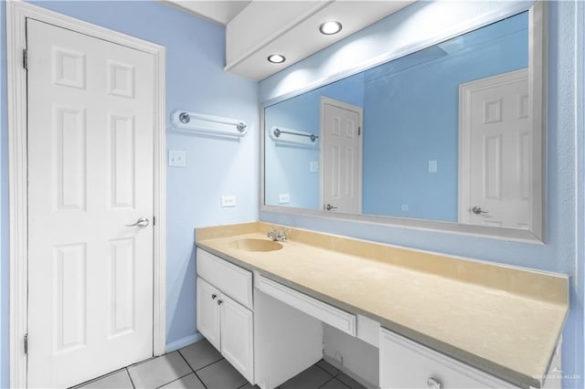 bathroom featuring tile patterned flooring and vanity